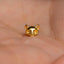 a gold cat shaped ring sitting on top of a person's hand