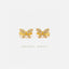 a pair of gold earrings with small diamonds on them.