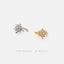 two pieces of jewelry, one silver and one gold, both adorned with sparkling diamonds.