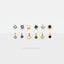 a collection of various gold-colored earrings with gemstones, arranged in a row on a white background.