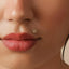 A close-up of a person's face, focusing on their lips and nose.
