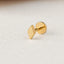 A single gold-colored earring is shown against a white background.