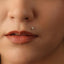 A close-up of a person's face, focusing on their lips and nose.