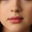 A close-up of a person's face, focusing on their lips and nose.