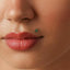 A close-up of a person's face, focusing on their lips and nose.