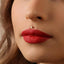 A close-up of a woman's face, focusing on her lips and nose.