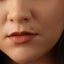 A close-up of a person's face, focusing on their nose and lips.