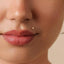 A close-up of a person's face, focusing on their lips and nose.