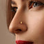 A close-up of a woman's face, focusing on her nose and lips.