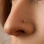 A close-up of a woman's face, focusing on her nose and lips.