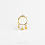 a gold ring with stars hanging from it