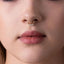 A close-up of a person's face, focusing on their nose and lips.
