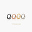 four rings of different colors - black, copper, gold, and silver - arranged in a row against a white background.