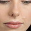 A close-up of a person's face, focusing on their nose and lips.