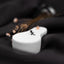 a close up of a white object on a black cloth