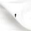 a single black bird is sitting on a white sheet