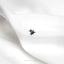 a pair of small black stars on a white fabric