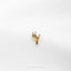 a gold ring on a white surface