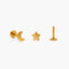 three gold-colored earrings: a crescent moon, a star, and a small post.