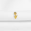 A single gold-colored flower-shaped pin is displayed against a white background.