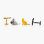 a collection of four unique cat-shaped objects, including a gold bird-shaped object, a silver cat-shaped object, a yellow cat-shaped object, and a black cat-shaped object.