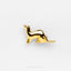 a gold kangaroo pin sitting on top of a white surface