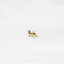 a gold kangaroo brooch sits on a white surface