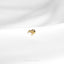 a close up of a gold ring on a white cloth