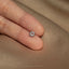 a person wearing a ring with a star of david on it