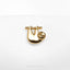 a gold plated pin with a sloth on it