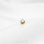 a gold earring with a cat's head on it