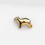 a gold pin with a dog on it