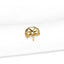 a close up of a white shirt with a gold brooch