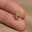 a person's finger with a gold ring on it
