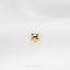 a close up of a small gold dog brooch