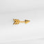 a pair of gold arrow earrings sitting on top of a white cloth