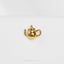a gold teapot brooch on a white background