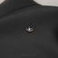 a close up of a pair of scissors on a black cloth
