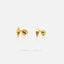 two gold earrings with diamond-shaped tips, placed against a white background.