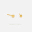 two small gold-colored earrings with a square-shaped design.