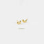 Two gold earrings with a heart shape are shown against a white background.