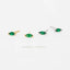 a collection of earrings with green gemstones, arranged in a row against a white background.