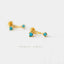 A pair of gold earrings with turquoise stones, displayed on a white background.
