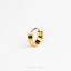 a gold ring on a white background