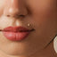 A close-up of a person's face, focusing on their lips and nose.