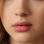 A close-up of a person's face, focusing on their lips and nose.