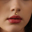 A close-up of a person's face, focusing on their lips and nose.
