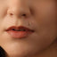 A close-up of a person's face, focusing on their lips and nose.