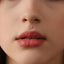 A close-up of a person's face, focusing on their lips and nose.
