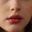 A close-up of a person's face, focusing on their lips and nose.